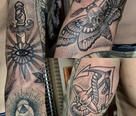 Dague, papillon et œil en noir et gris sur le bras