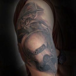 Portrait d'homme au chapeau en noir et gris sur le bras