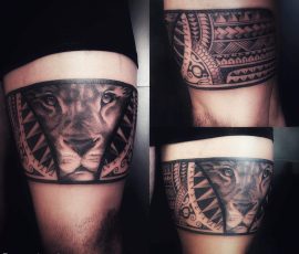 Bracelet polynésien et tête de lion en noir et gris sur la cuisse